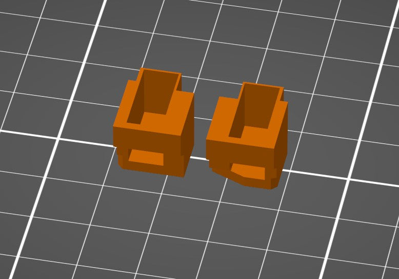 Digitale CAD Vorschau von zwei orangen PS4 Smarttrigger 3D Modellen auf grauem Gitterhintergrund