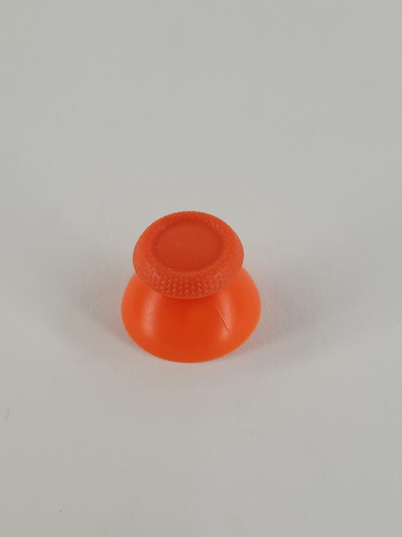 Orangefarbener Analogstick Aufsatz für PS5 und PS4 Controller mit strukturierter Oberfläche