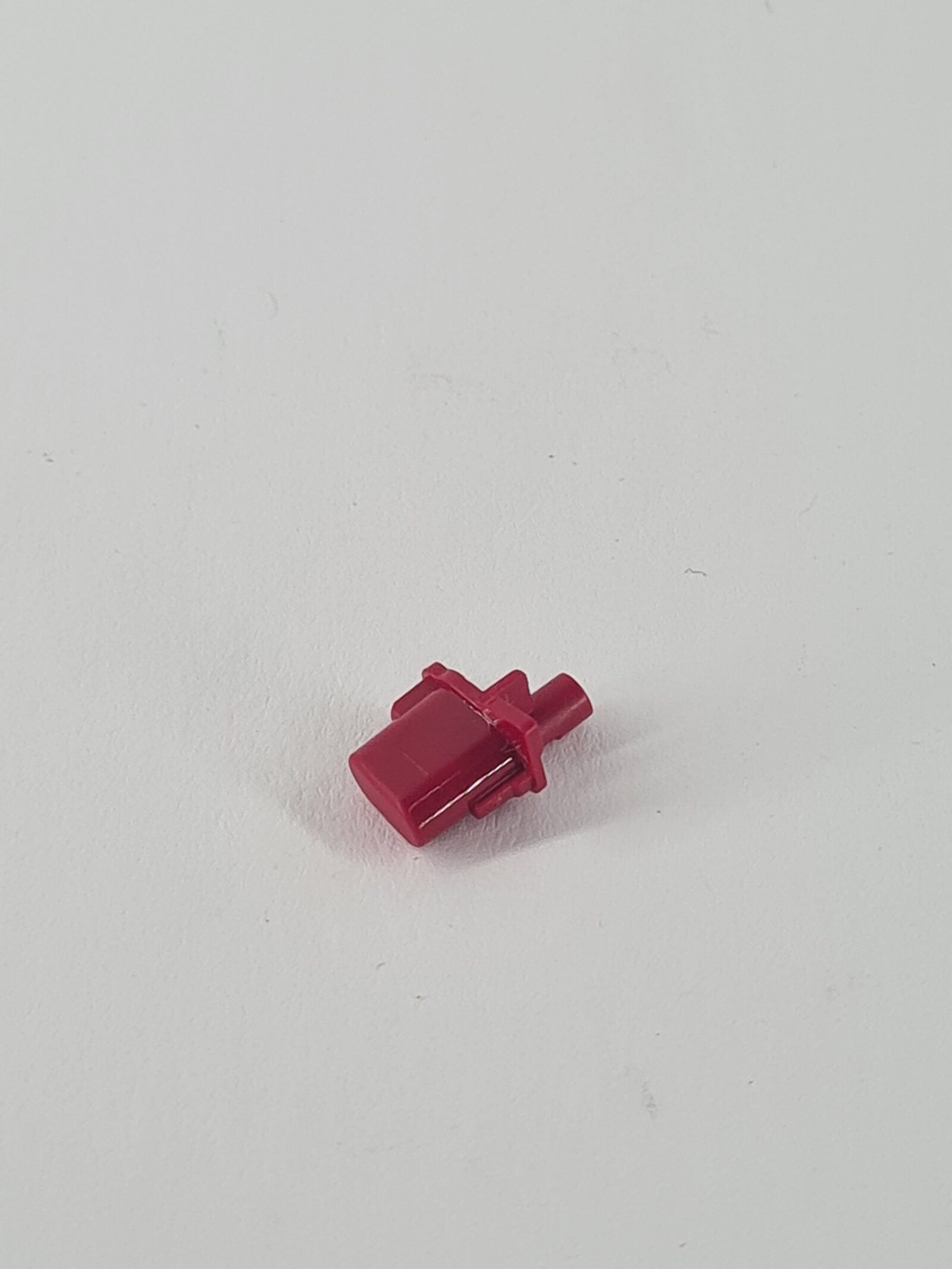 Rote originale PS5 Option Taste aus Kunststoff mit zylindrischem Stift und Verriegelungsnasen